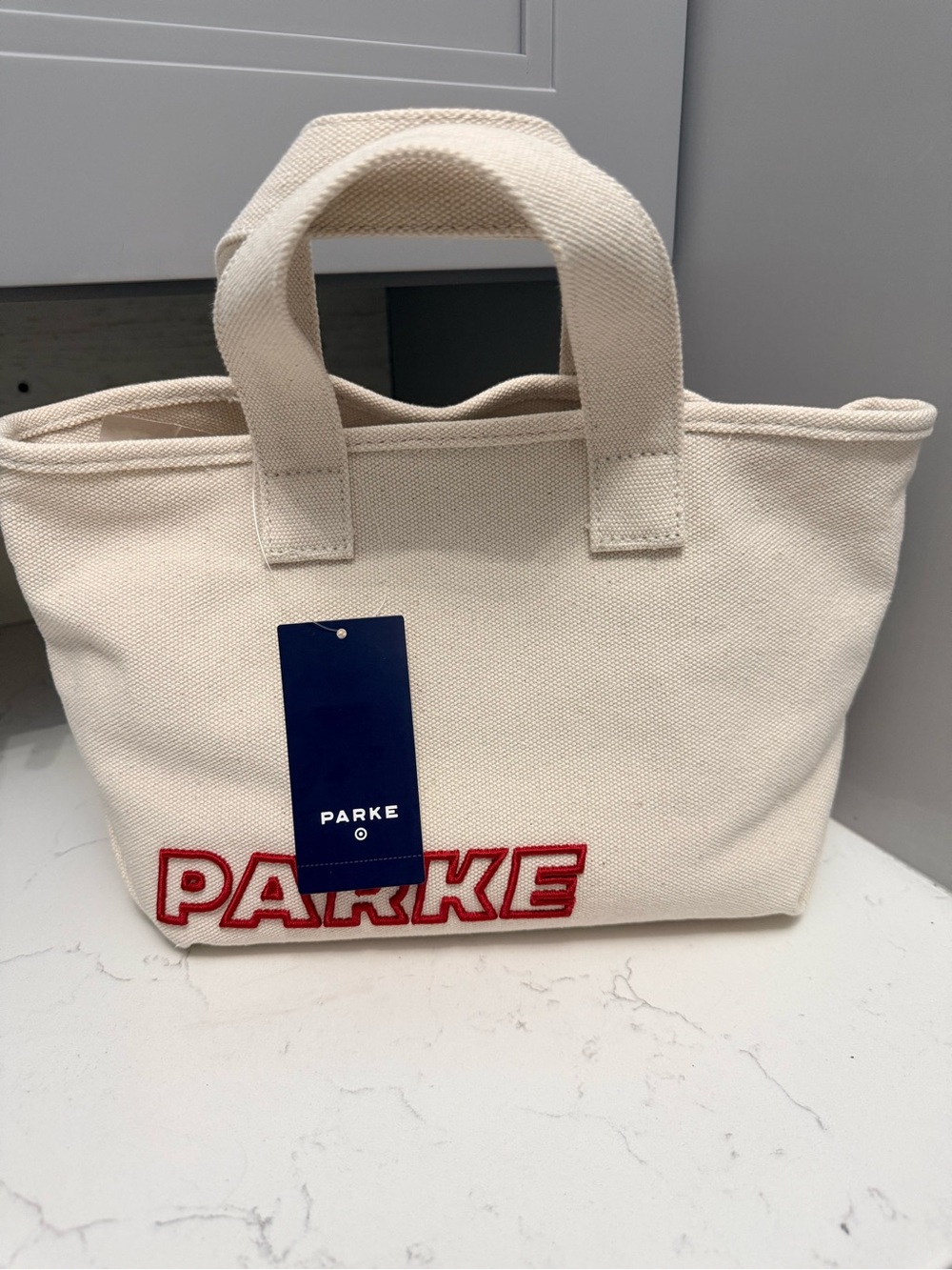 Parke NWT Cream Canvas Tote Bag with Red Logo